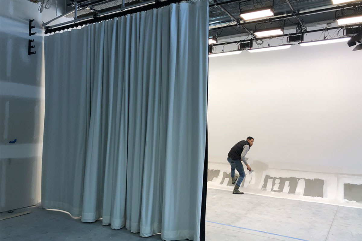 Man Installing Cyclorama